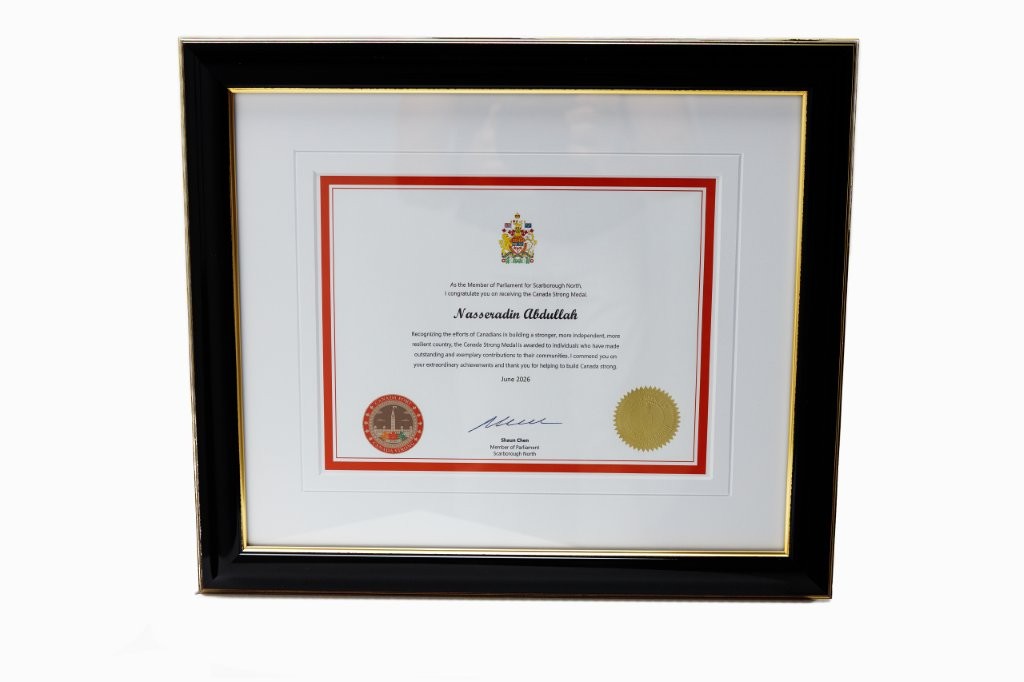 Framed Canada Strong Medal certificate awarded to Nasseradin Abdullah by Shaun Chen, Member of Parliament for Scarborough North.
